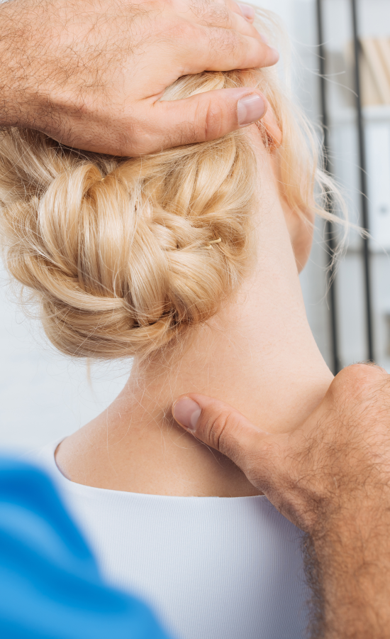 Physical therapist uses gentle fascial counterstrain technique to adjust position of patient's neck