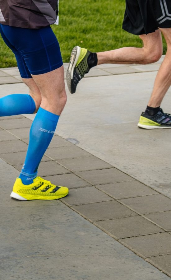 People running with compression garments on their legs